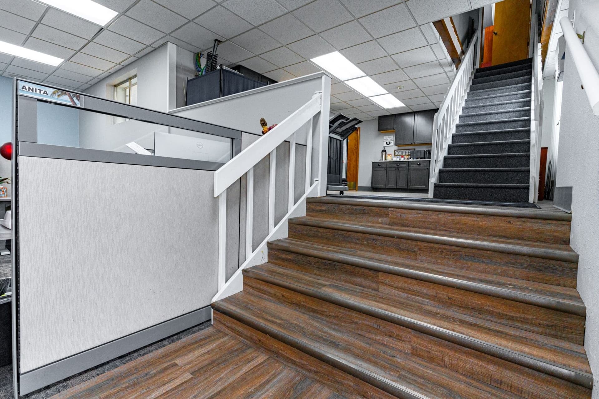 Commercial interior with office stairs and employee kitchen by Kiefer Built Contracting