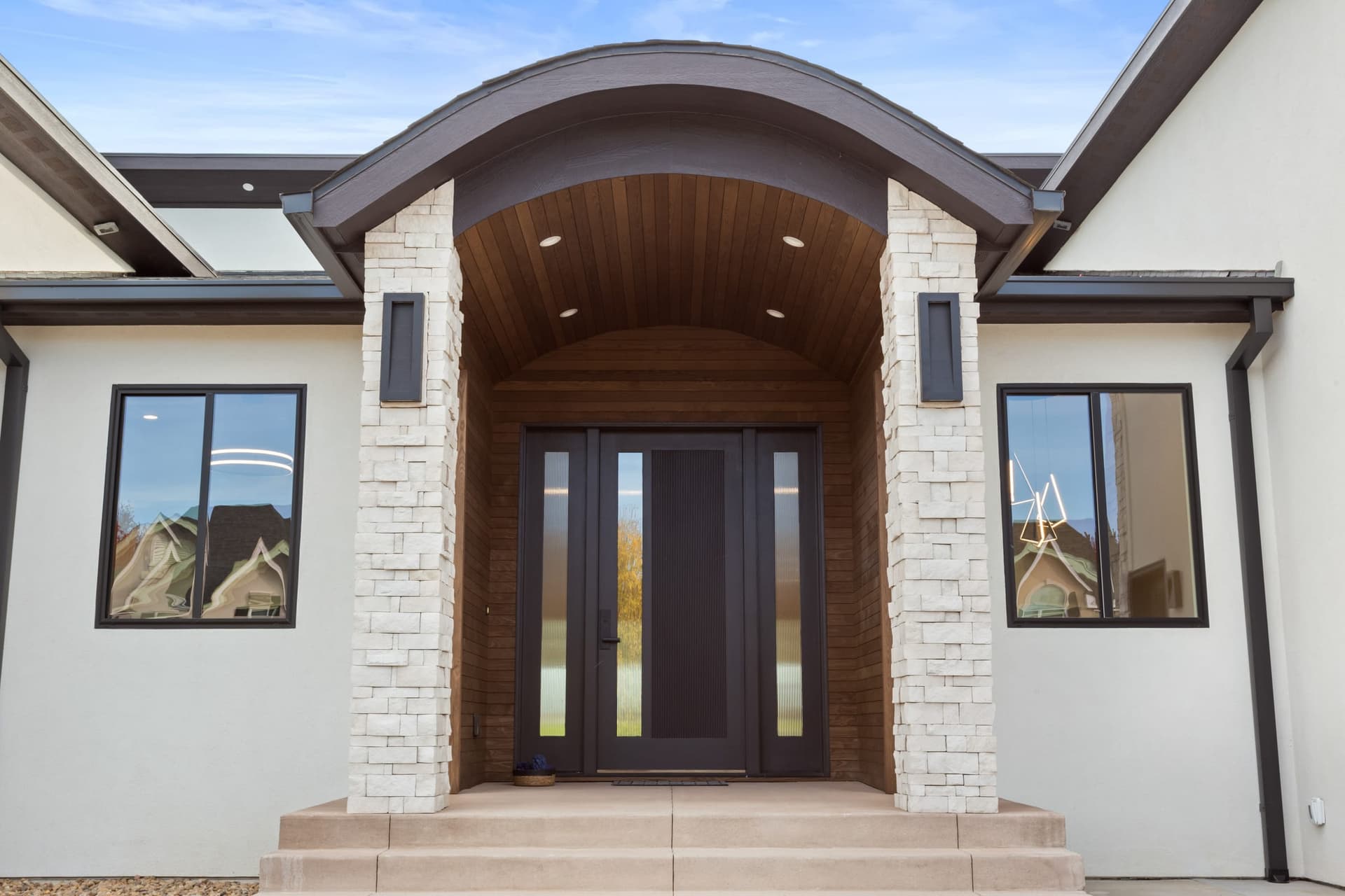 Covered exterior entry portico by Kiefer Built Contracting