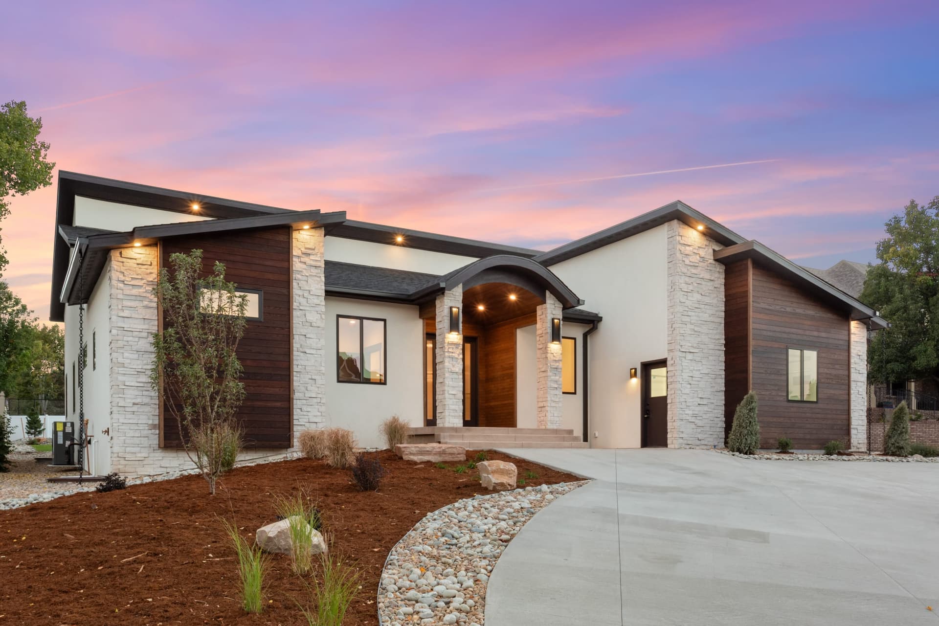 Kiefer Built custom contemporary ranch home at twilight in Northern Colorado