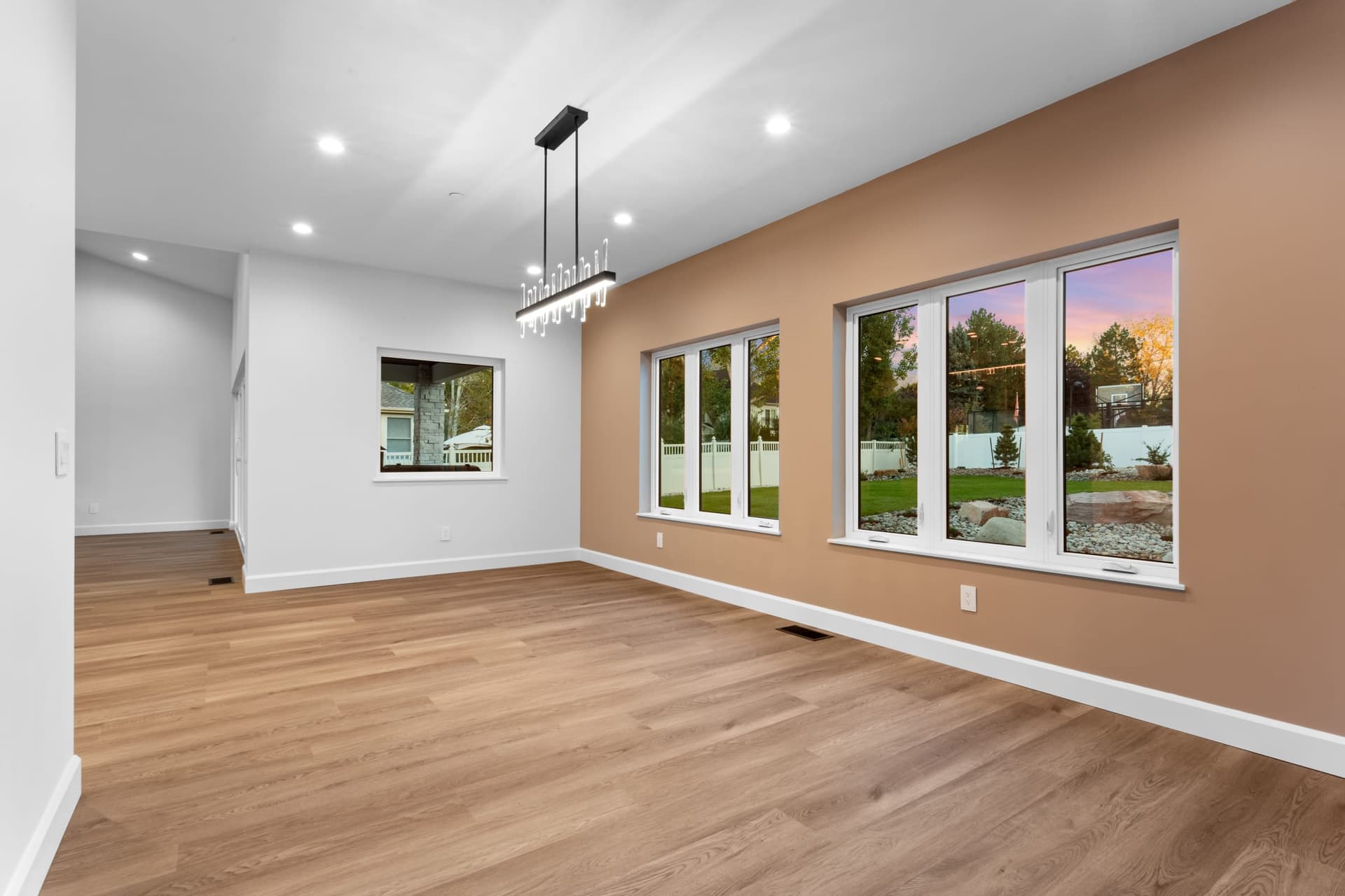 Laundry room — recessed window niche, white walls, GE Profile front-load washer
