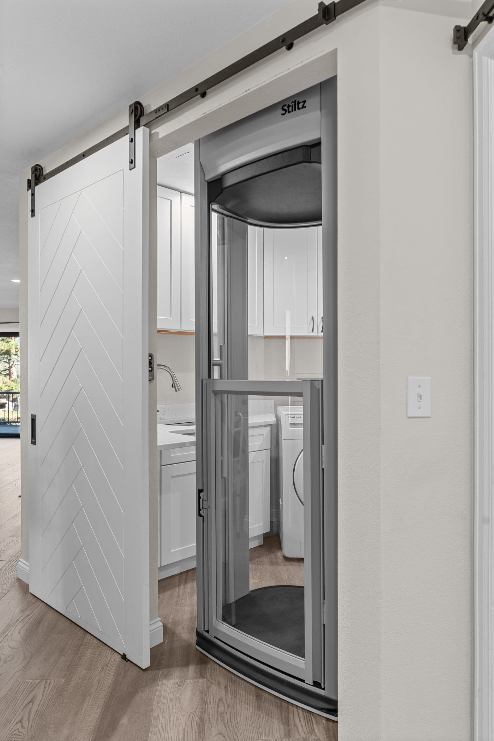 Custom residential elevator doorway and wall finish by Kiefer Built Contracting